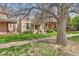 View of the home from the front yard, showcasing the lawn and neighborhood at 2222 N Williams St, Denver, CO 80205