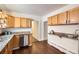 Kitchen featuring stainless steel appliances, granite countertops, and light wood cabinetry at 2222 N Williams St, Denver, CO 80205