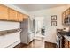 Well-lit kitchen with stainless steel refrigerator, wood cabinets, and granite countertops at 2222 N Williams St, Denver, CO 80205
