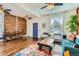 Open-concept living room showcasing hardwood floors, exposed brick wall, and stylish furnishings at 2222 N Williams St, Denver, CO 80205