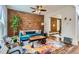 Eclectic living room features a exposed brick wall, modern furniture, and hardwood floors at 2222 N Williams St, Denver, CO 80205