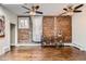 Spacious living area with hardwood floors, exposed brick, and neutral decor at 2222 N Williams St, Denver, CO 80205