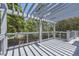 Back deck with a pergola providing shade, metal railings, and views of the surrounding greenery at 540 Ithaca Dr, Boulder, CO 80305