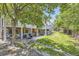 Back yard with a patio, grill, and pergola covered deck, surrounded by a grassy yard at 540 Ithaca Dr, Boulder, CO 80305
