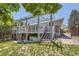 Backyard featuring a pergola covered deck, patio, lawn, and view of the home at 540 Ithaca Dr, Boulder, CO 80305
