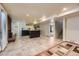 Finished basement featuring tile flooring, a bar area, and a cozy fireplace at 540 Ithaca Dr, Boulder, CO 80305