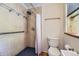Shower stall with tile surround, safety bar, shower head and hand held sprayer at 540 Ithaca Dr, Boulder, CO 80305
