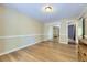 Neutral bedroom featuring hardwood floors and a sliding door mirrored closet at 540 Ithaca Dr, Boulder, CO 80305