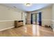 Bedroom with light wood floors and a glass door with curtains leading outside at 540 Ithaca Dr, Boulder, CO 80305