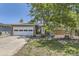 Charming single-story home featuring a brick facade, two car garage, and xeriscaped front yard at 540 Ithaca Dr, Boulder, CO 80305