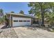 Charming single-story home featuring a brick facade, two car garage, and xeriscaped front yard at 540 Ithaca Dr, Boulder, CO 80305