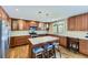 Updated kitchen with stainless steel appliances, an island with seating, and plenty of natural light at 540 Ithaca Dr, Boulder, CO 80305