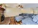 Spacious living room features a hardwood floor, fireplace, and a comfortable modern sectional sofa at 540 Ithaca Dr, Boulder, CO 80305