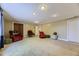 Spacious living room with carpeted floors, recessed lighting, and ample seating with comfortable chairs at 540 Ithaca Dr, Boulder, CO 80305