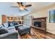 Open concept living room and kitchen, hardwood floors, brick fireplace and modern décor at 540 Ithaca Dr, Boulder, CO 80305