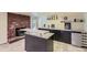 Basement wet bar with brick accent wall and wine storage at 540 Ithaca Dr, Boulder, CO 80305
