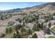 Stunning neighborhood aerial view showcases a home's lush surroundings and mountain views at 4 White Fir Ct, Littleton, CO 80127