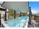 Relax in the partially covered backyard hot tub and swimming pool with beautiful views at 4 White Fir Ct, Littleton, CO 80127