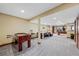 Finished basement featuring games area with foosball, air hockey and pool table at 4 White Fir Ct, Littleton, CO 80127