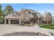 Charming two-story home featuring a well-maintained front yard, a concrete driveway, and an attached garage at 4 White Fir Ct, Littleton, CO 80127