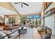 Inviting living room showcasing high ceilings, hardwood floors, a fireplace, and expansive windows with scenic views at 4 White Fir Ct, Littleton, CO 80127