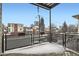 A view of the street from the balcony with mesh railing at 336 E 1St Ave # 200, Denver, CO 80203