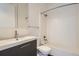 Clean bathroom with a sleek vanity, modern faucet, white subway tile shower, and well-lit mirror at 336 E 1St Ave # 200, Denver, CO 80203