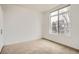 Sunny bedroom featuring a large window overlooking the city at 336 E 1St Ave # 200, Denver, CO 80203