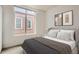 Well-lit bedroom with a large window and comfortable furnishings at 336 E 1St Ave # 200, Denver, CO 80203