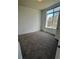 Bedroom featuring carpet, light and a large window looking out to the yard at 336 E 1St Ave # 200, Denver, CO 80203