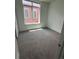 Bright bedroom featuring a large window and neutral carpeting, perfect for relaxation at 336 E 1St Ave # 200, Denver, CO 80203