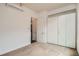 Bright carpeted bedroom featuring a modern closet, neutral colors, and mini split system at 336 E 1St Ave # 200, Denver, CO 80203