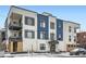 Stylish multi-story condo building with blue and white exterior and balcony at 336 E 1St Ave # 200, Denver, CO 80203