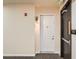Well-lit hallway with a fire alarm, exit sign, and access to the unit at 336 E 1St Ave # 200, Denver, CO 80203