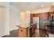 Contemporary kitchen with a central island, stainless steel dishwasher, and modern lighting at 336 E 1St Ave # 200, Denver, CO 80203