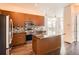 Well-equipped kitchen with granite countertops, stainless steel appliances, and a central island with barstool seating at 336 E 1St Ave # 200, Denver, CO 80203