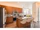 Modern kitchen with granite countertops, stainless steel appliances, an island with seating, and pendant lighting at 336 E 1St Ave # 200, Denver, CO 80203