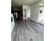 Living room with open layout, hardwood floors, and sliding glass door at 336 E 1St Ave # 200, Denver, CO 80203