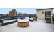 Spacious snow covered rooftop deck with comfortable seating, offering an excellent outdoor living space at 336 E 1St Ave # 200, Denver, CO 80203