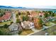 An aerial view showcases the neighborhood's proximity to the lake and mountains at 8427 Pierson Ct, Arvada, CO 80005