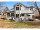 Large backyard featuring a patio area with outdoor furniture and mature landscaping at 8427 Pierson Ct, Arvada, CO 80005