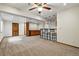 Basement with bar area, carpet, ceiling fan, and recessed lighting at 8427 Pierson Ct, Arvada, CO 80005