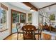 Cozy dining area features sliding glass doors to the yard and backyard views at 8427 Pierson Ct, Arvada, CO 80005