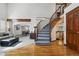 Elegant foyer showcasing hardwood floors, a staircase, and an open layout connecting to the living spaces at 8427 Pierson Ct, Arvada, CO 80005
