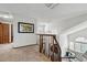 Open and airy hallway showcasing the home's architectural details, including vaulted ceilings and arched windows at 8427 Pierson Ct, Arvada, CO 80005