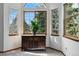 Cozy sitting area featuring a cabinet with multiple windows that let in plenty of natural light at 8427 Pierson Ct, Arvada, CO 80005