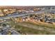 Picture of neighborhood near golf course and highway featuring trees and many townhomes at 2061 S Worchester Way, Aurora, CO 80014