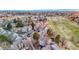Overhead view of neighborhood with manicured green spaces and residential area at 2061 S Worchester Way, Aurora, CO 80014