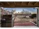 View from the back patio of the house showcasing the outdoor grill and golf course view at 2061 S Worchester Way, Aurora, CO 80014