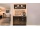 Entertainment area features custom bar with espresso machine, granite counters and wine glass storage at 2061 S Worchester Way, Aurora, CO 80014